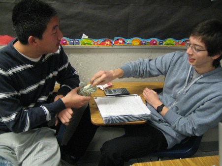  Roger Lee hands around a small donation jar while senior Matthew Downing donates $1. The UNICEF officers collected donations in front of SAC and passed around donation jars during class. “We’d like to thank everyone who came to donate for the cause,” Lee said. “Hopefully, we can continue to be successful in future projects.” PC: Priscilla Ng 