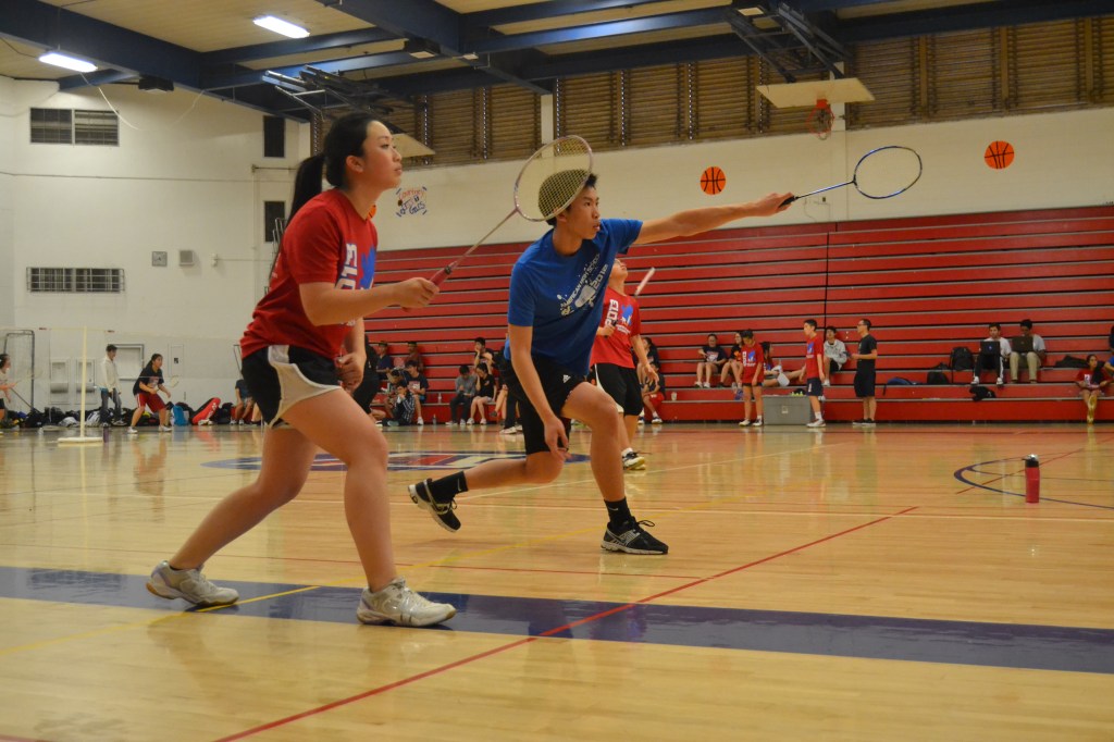 Caption: Junior Serena Leung and senior Andrew Le prepare to return a shot to continue the rally against their Washington opponents. Playing mixed events requires coordination and communication between partners during the action of the games. “As captain, I hope to inspire the new players to continue playing a sport that they love and to have fun while playing,” Au said. PC: Priscilla Ng