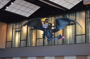  A cutout of Hiccup and Toothless, advertising How to Train Your Dragon 2, hangs from the ceiling of the Century Theaters in Pacific Commons. The movie features actors Jonah Hill, Kristin Wiig, and Kit Harrington. It will be released June 13, 2014.