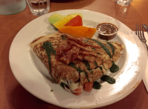 The Buffalo Crepe is complemented with bacon strips and pesto sauce on the top, and buffalo sauce on the side to give it a spicy, hot taste. Some fruits are also provided to soothe your mouth after a burning, hot sensation from the buffalo sauce.