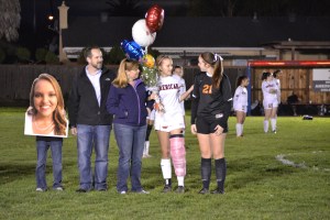 Zack, Morgan, Michelle, and Rhianna Soares (12), and her best friend Chloe Lambert line up with the rest of the families during senior night on February 12, 2015 at American High School. “I was extremely happy and excited for the game, but knowing [that] it was my last [game] gave me mixed emotions of happy and sad,” Soares said.
